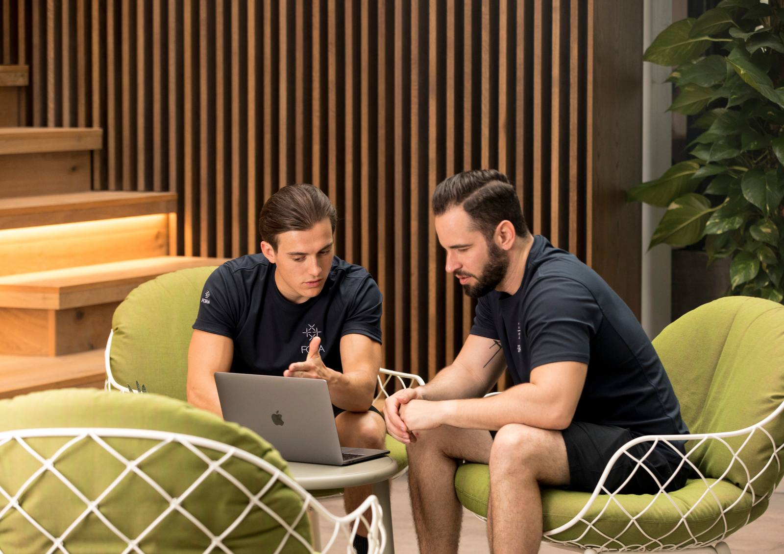 A Limitless Health specialist talking an executive through their plan on a laptop